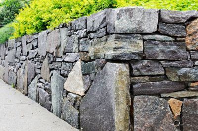 Get Erosion Prevention and Soil Stabilization with a Stone Retaining Wall!
